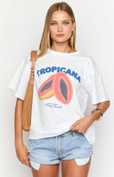 Girl wearing an oversized graphic tee featuring a tropicana print